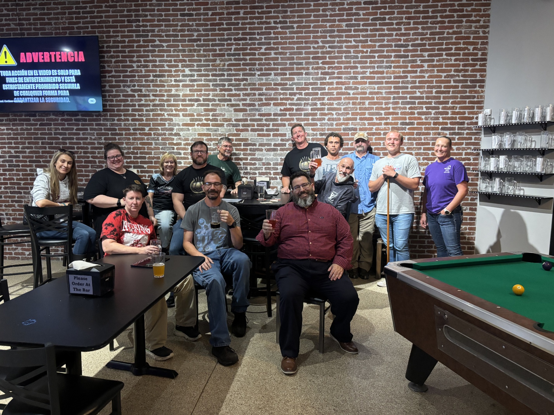 Veterans and supporters posing together during a Muster gathering.