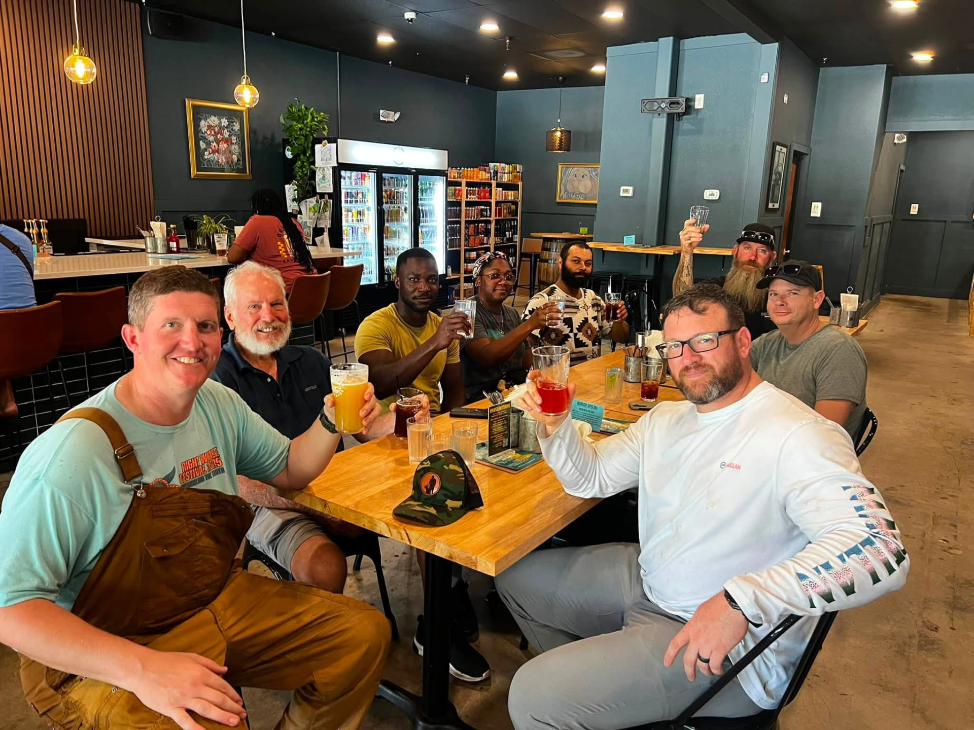 The Homefront volunteer crew sharing a meal together after finishing the work at a veteran household.