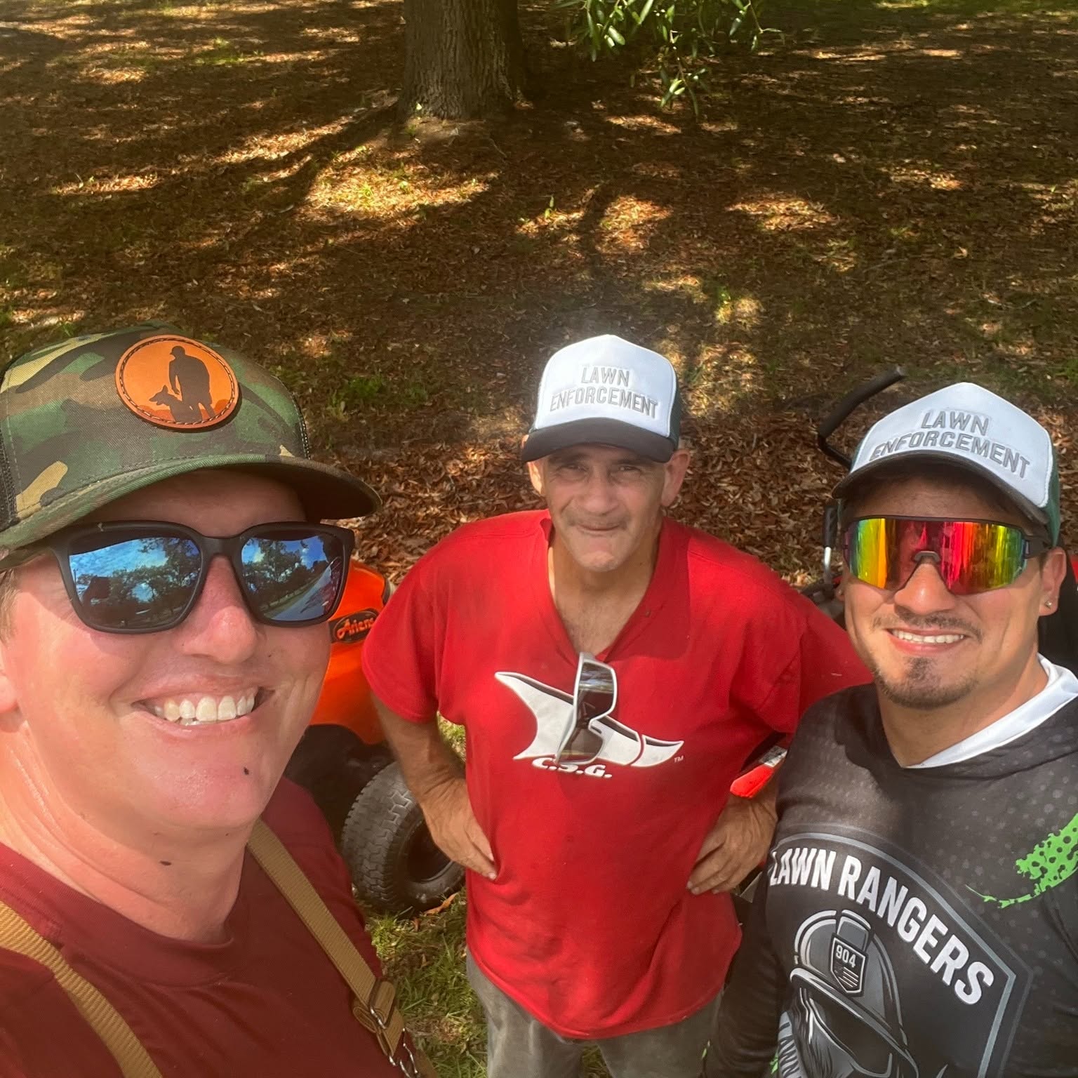 The Veterans Phalanx alongside Lawn Rangers crew members after completing a donated yard cut for a veteran household.
